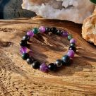 Pure Crystal's stress relief healing crystal bracelet is designed to ground you, calm your mind, and combat feelings of fear and insecurity. Made with natural beads of MOss Agate, Amethyst, Hematite, and Obsidian. 